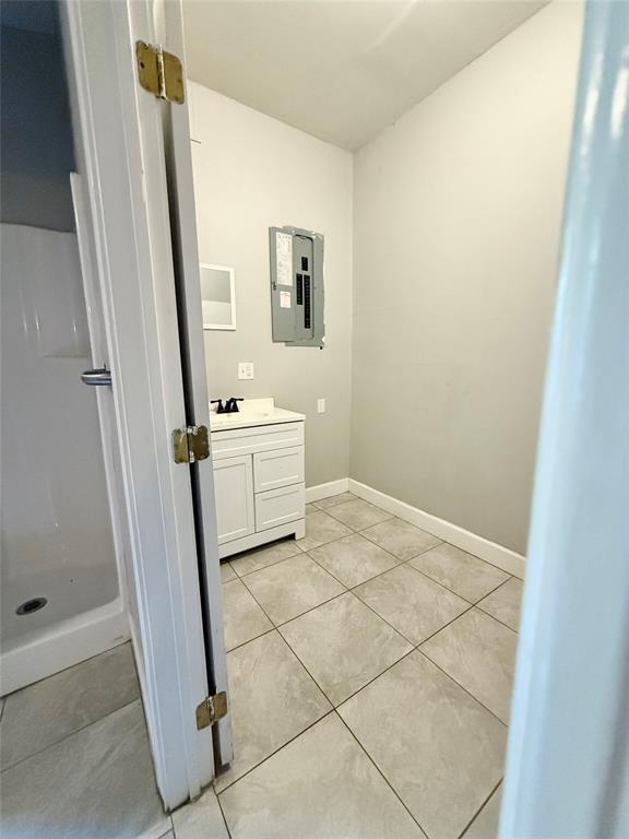 908 Sycamore Athens, TX 75751 - Photo 20 of 28 a bathroom with a sink a mirror and a shower