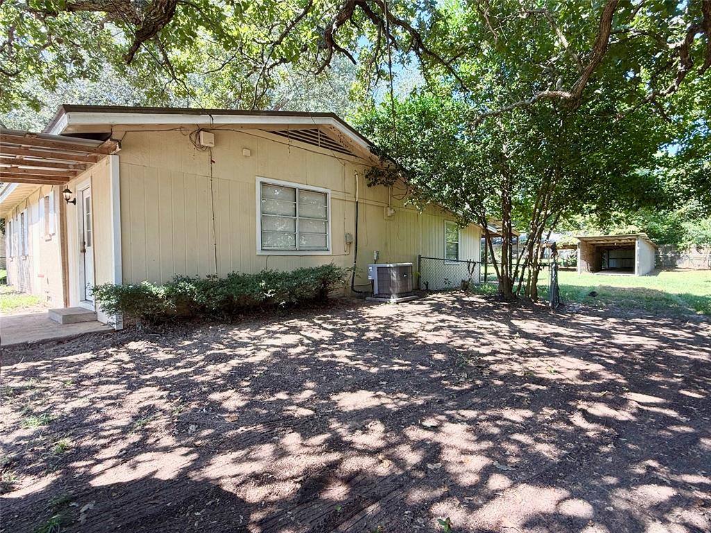 908 Sycamore Athens, TX 75751 - Photo 22 of 28 a view of a house with a yard