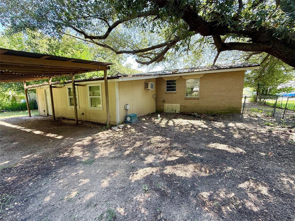 908 Sycamore Athens, TX 75751 - Photo 23 of 28 a view of a house with a large tree