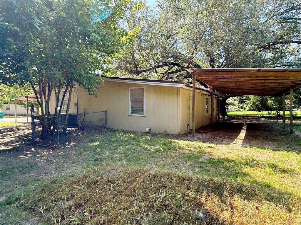 908 Sycamore Athens, TX 75751 - Photo 24 of 28 a backyard of a house with lots of green space