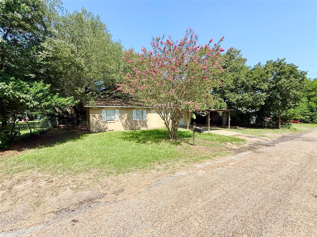908 Sycamore Athens, TX 75751 - Photo 4 of 28 a front view of a house with a yard