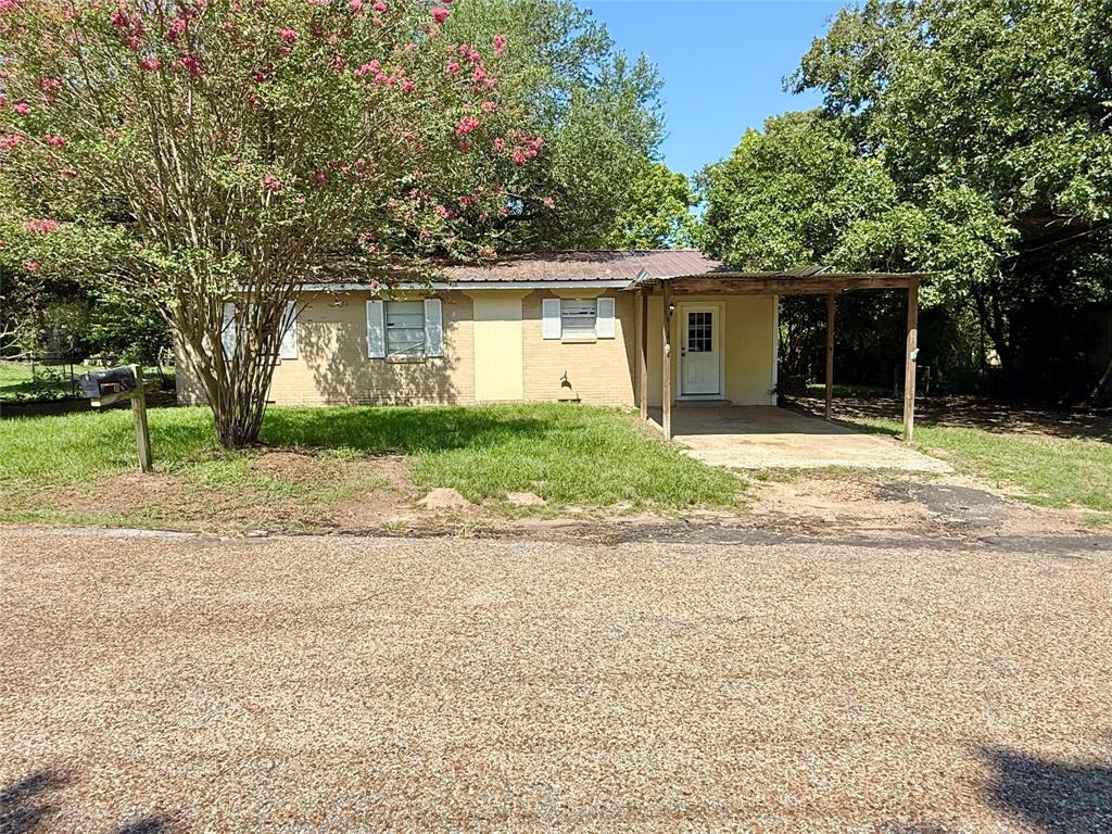 908 Sycamore Athens, TX 75751 - Photo 5 of 28 a house with trees in the background