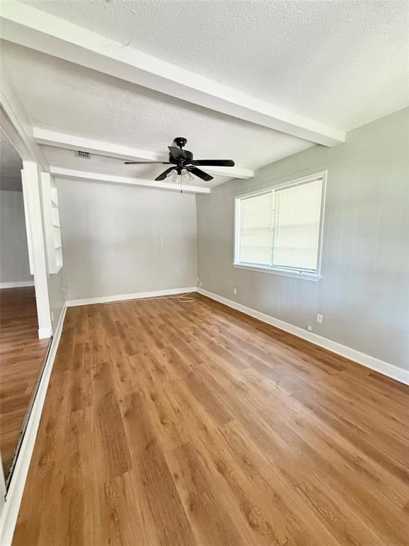 908 Sycamore Athens, TX 75751 - Photo 9 of 28 a view of empty room with wooden floor