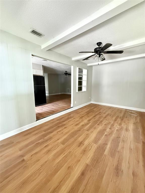 908 Sycamore Athens, TX 75751 - Photo 10 of 28 a view of empty room with wooden floor and fan
