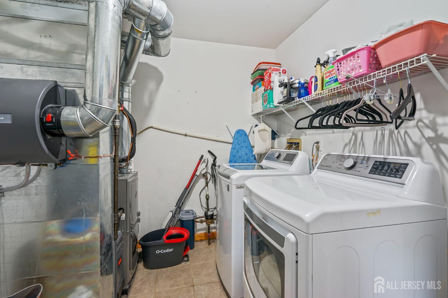 41 Rodak Circle Edison, NJ 08817 - Photo 26 of 28 a utility room with dryer and washer