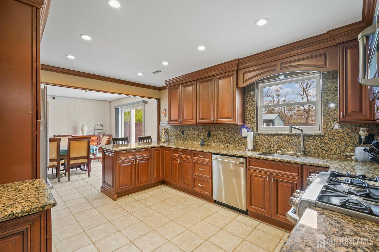 41 Rodak Circle Edison, NJ 08817 - Photo 10 of 28 a kitchen with sink refrigerator and stove