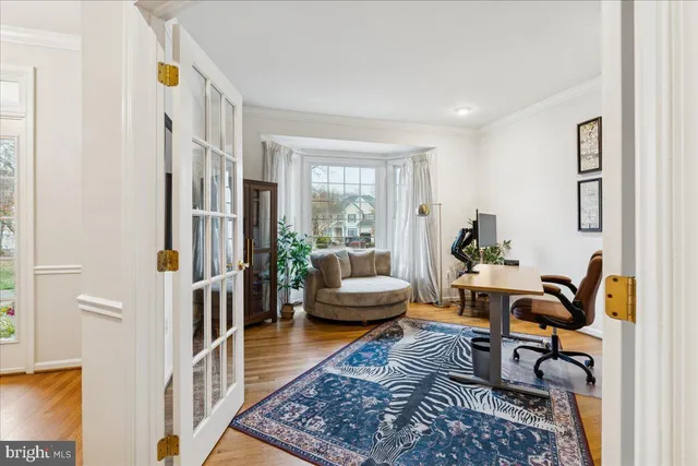 a living room with furniture rug and a window