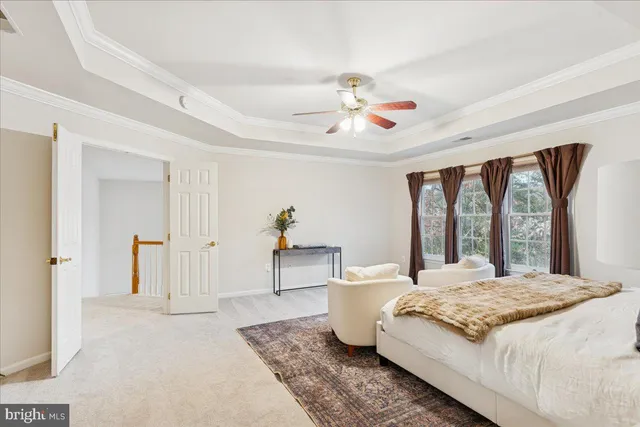 a spacious bathroom with a tub sink and mirror