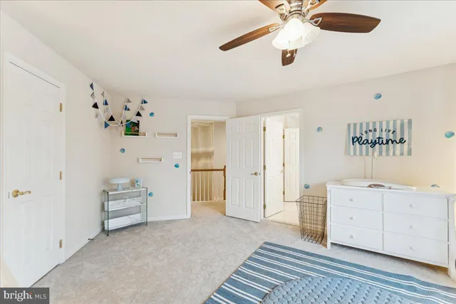a spacious bathroom with a double vanity sink and a mirror