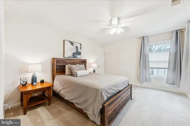 a view of a staircase with wooden floor and a window