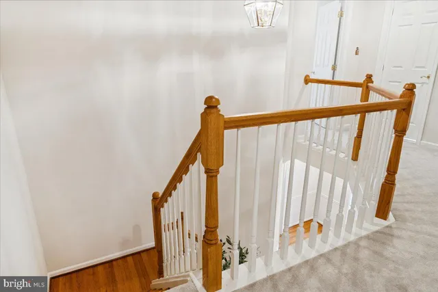 a living room with furniture and a lamp