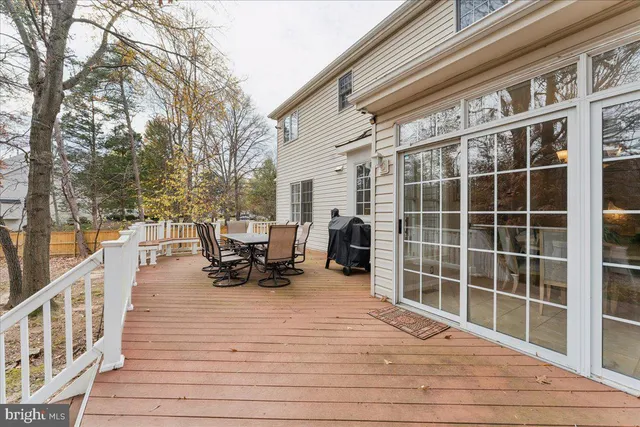 a white house that has a tree in front of it