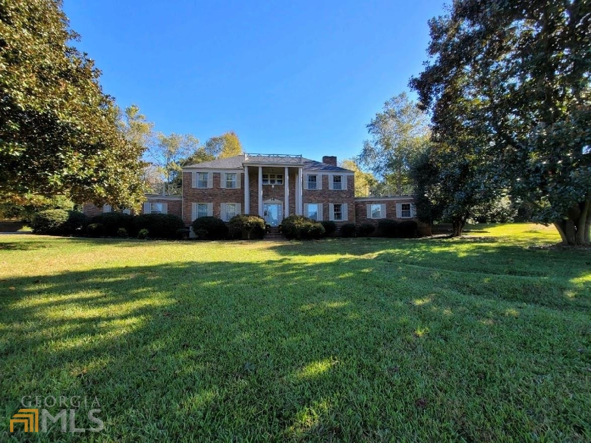 7595 Stone Bridge Road Carnesville, GA 30521 - Photo 1 of 1 a view of a house with a big yard