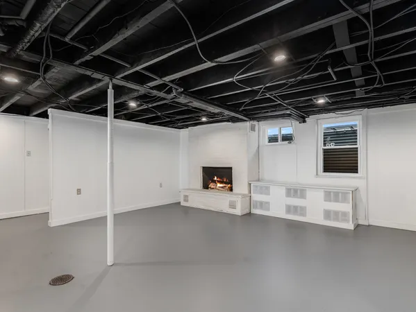 a view of an empty room with white walls