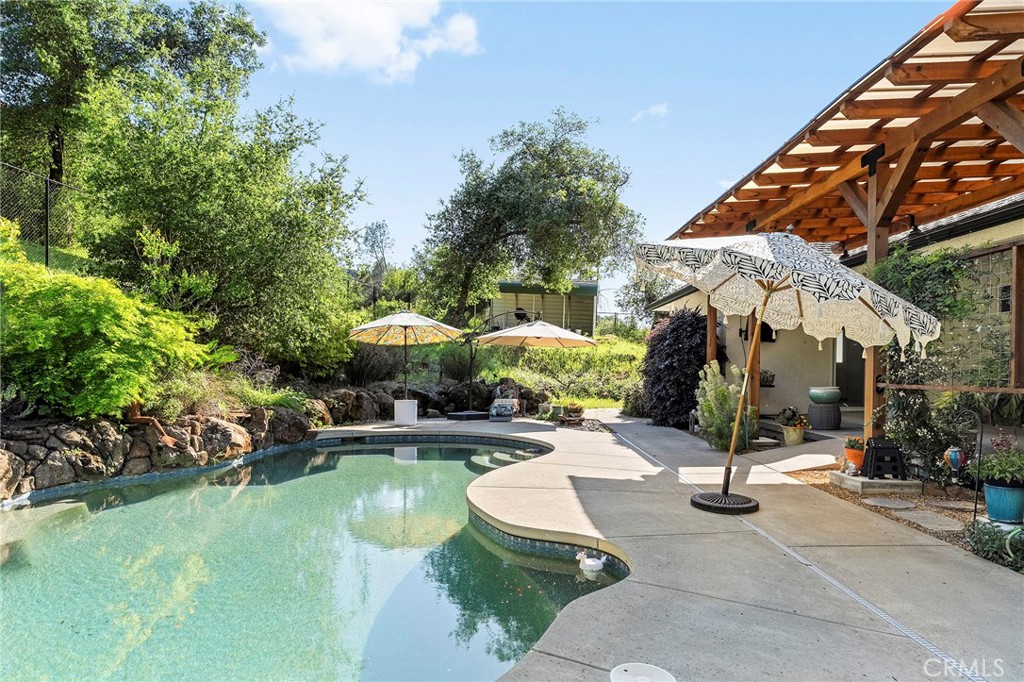 2262 Honey Run Road Chico, CA 95928 - Photo 61 of 74 a swimming pool with outdoor seating and yard