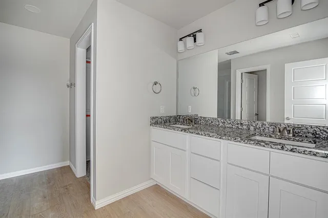 a bathroom with a glass shower door
