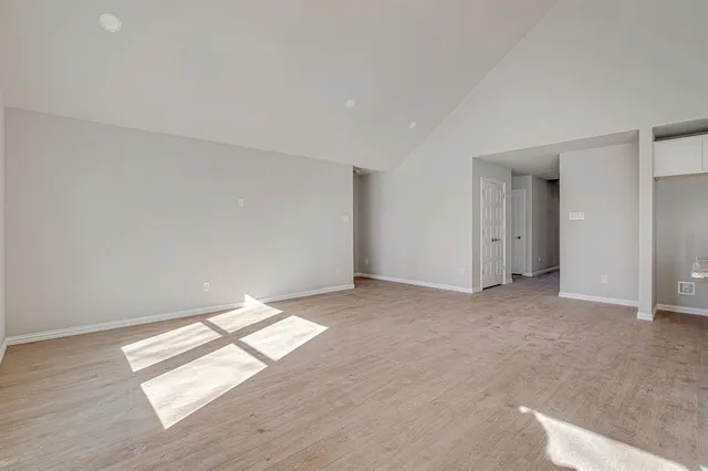 a view of a kitchen with wooden floor