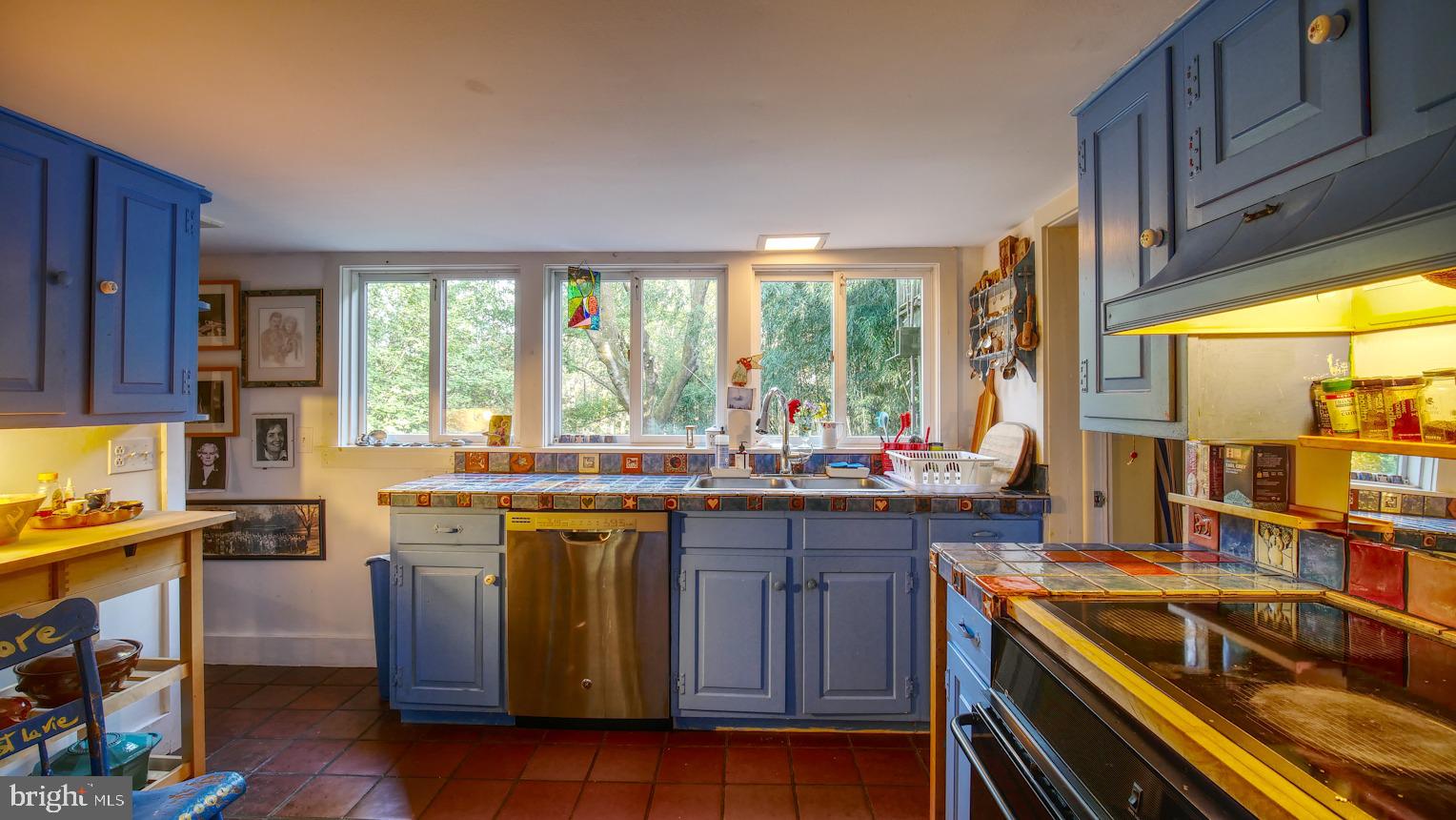 7416 Ferry Road New Hope, PA 18938 - Photo 12 of 33 a kitchen with lots of counter top space and wooden floor