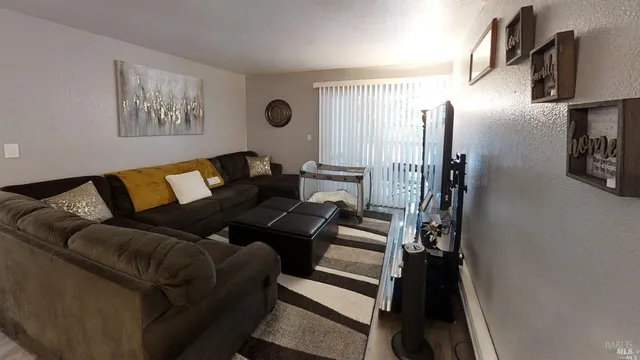 a living room with furniture and a rug