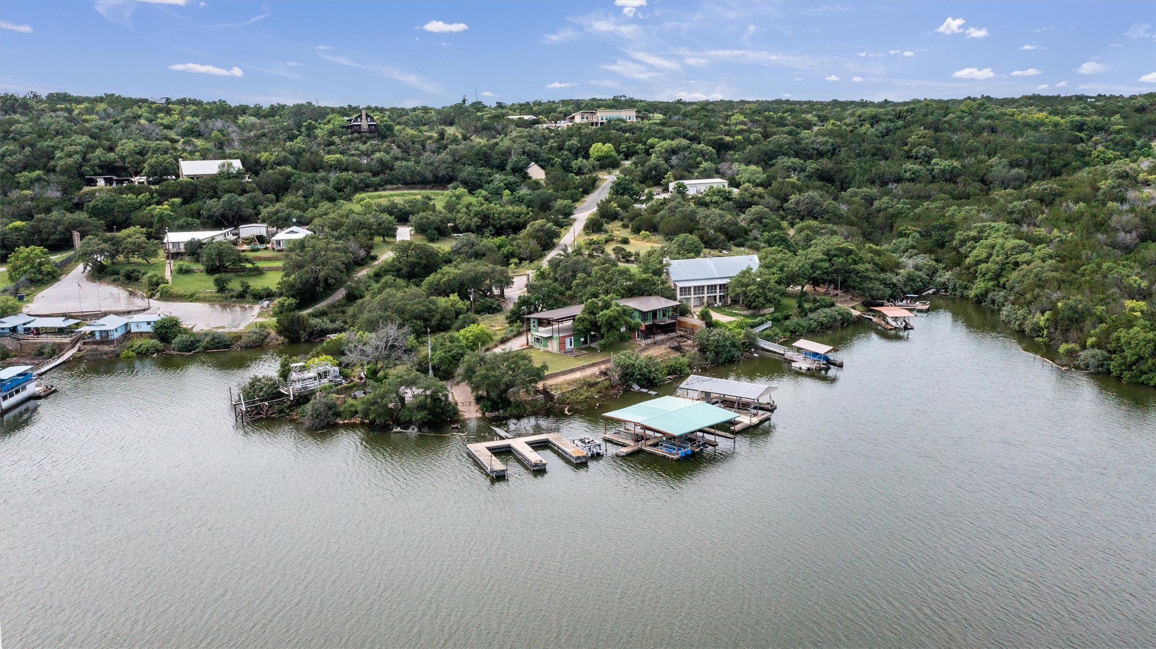 325 Eagle Rest Burnet, TX 78611 - Photo 4 of 40 Riverside retreat offering multiple boat docks, a private boat house, and serene waterfront living.