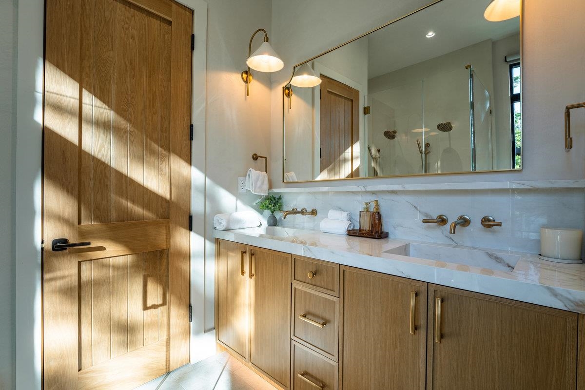 9308 Nine Bark Road Truckee, CA 96161 - Photo 13 of 27 a bathroom with a double vanity sink and a mirror