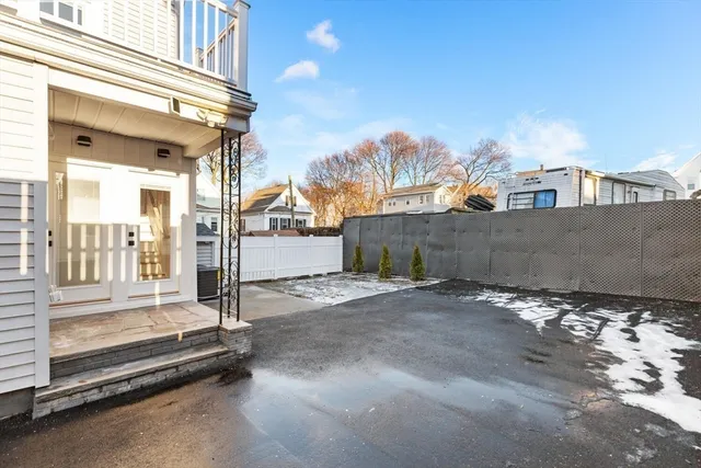 a view of a street with a building in the background