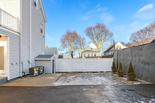 a view of a house with a yard and garage