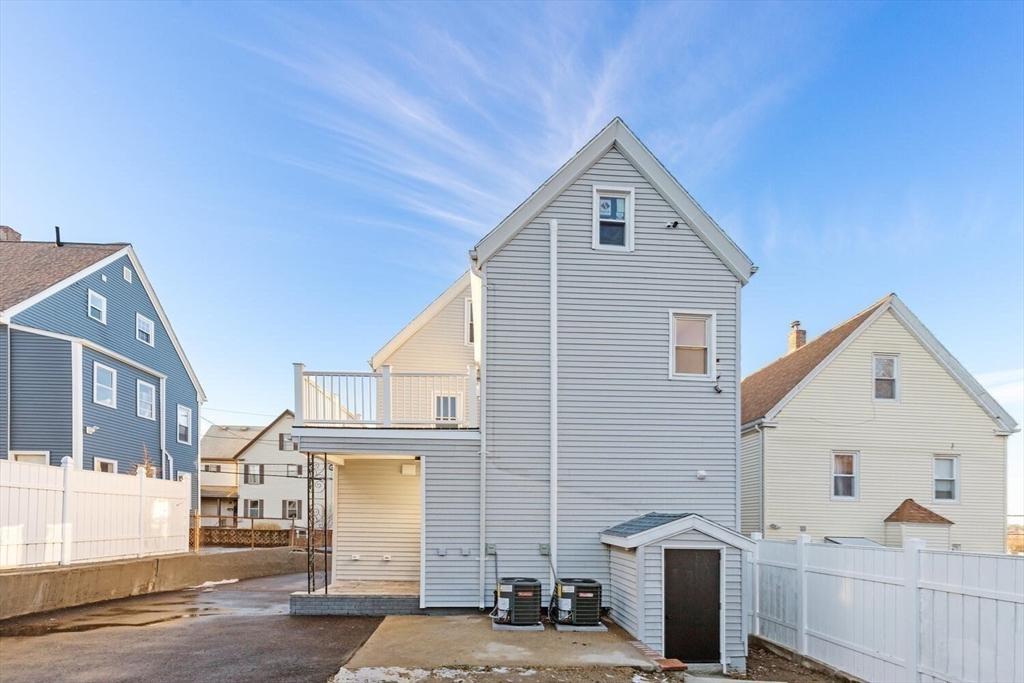 7 Bennett Street, Unit 1 Medford, MA 02155 - Photo 35 of 38 a view of a house with a yard