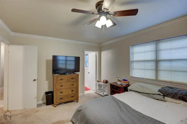 a bedroom with a bed and furniture