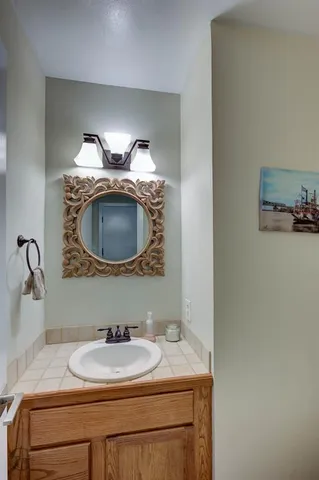 a bathroom with a sink and a mirror
