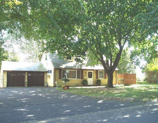 12 Cambridge Road Stamford, CT 06902 - Photo 1 of 1 a view of a house with a yard and large tree