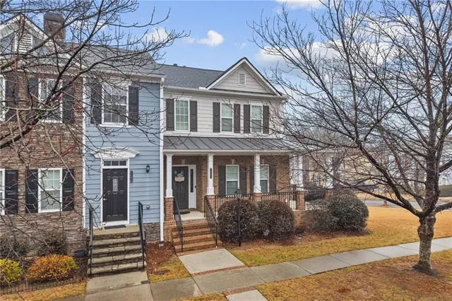 front view of a brick house with a large windows
