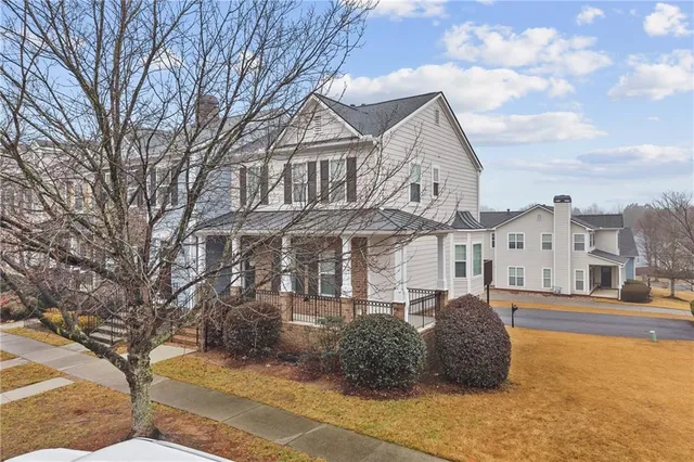a view of a kitchen with a refrigerator and a stove top oven