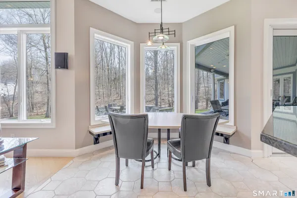 a view of a dining room with furniture wooden floor and chandelier