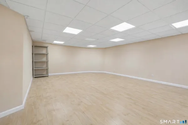 an empty room with a empty space and windows