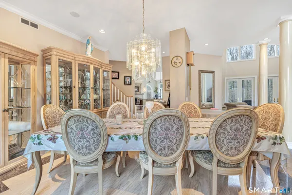 a view of a dining room with furniture window and wooden floor