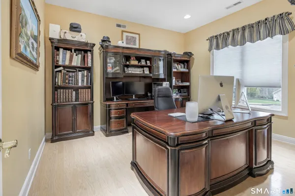 a kitchen with stainless steel appliances granite countertop a stove and a refrigerator
