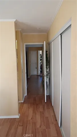 a view of hallway with wooden floor