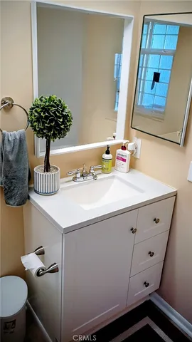 a bathroom with a sink and a mirror