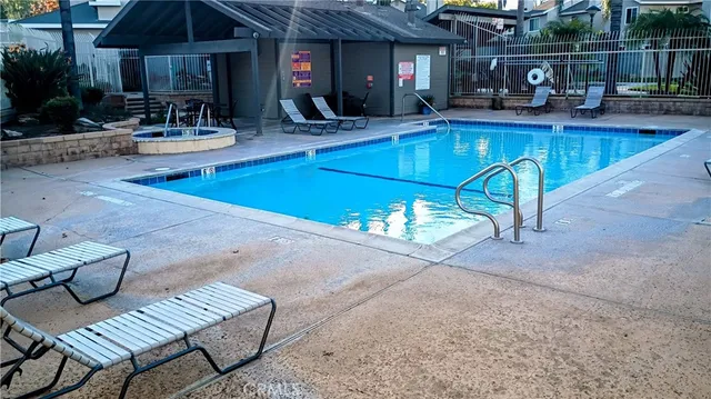 a view of patio with chairs and potted plants