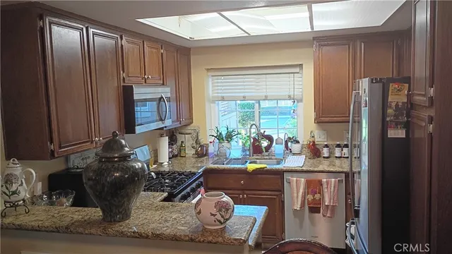 a room with wooden floor and a table chair