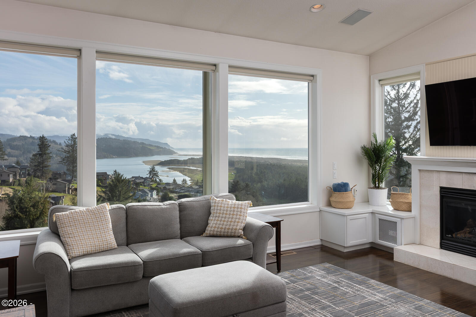 7415 East Summit Road Pacific City, OR 97135 - Photo 5 of 44 a living room with furniture a large window and a fireplace
