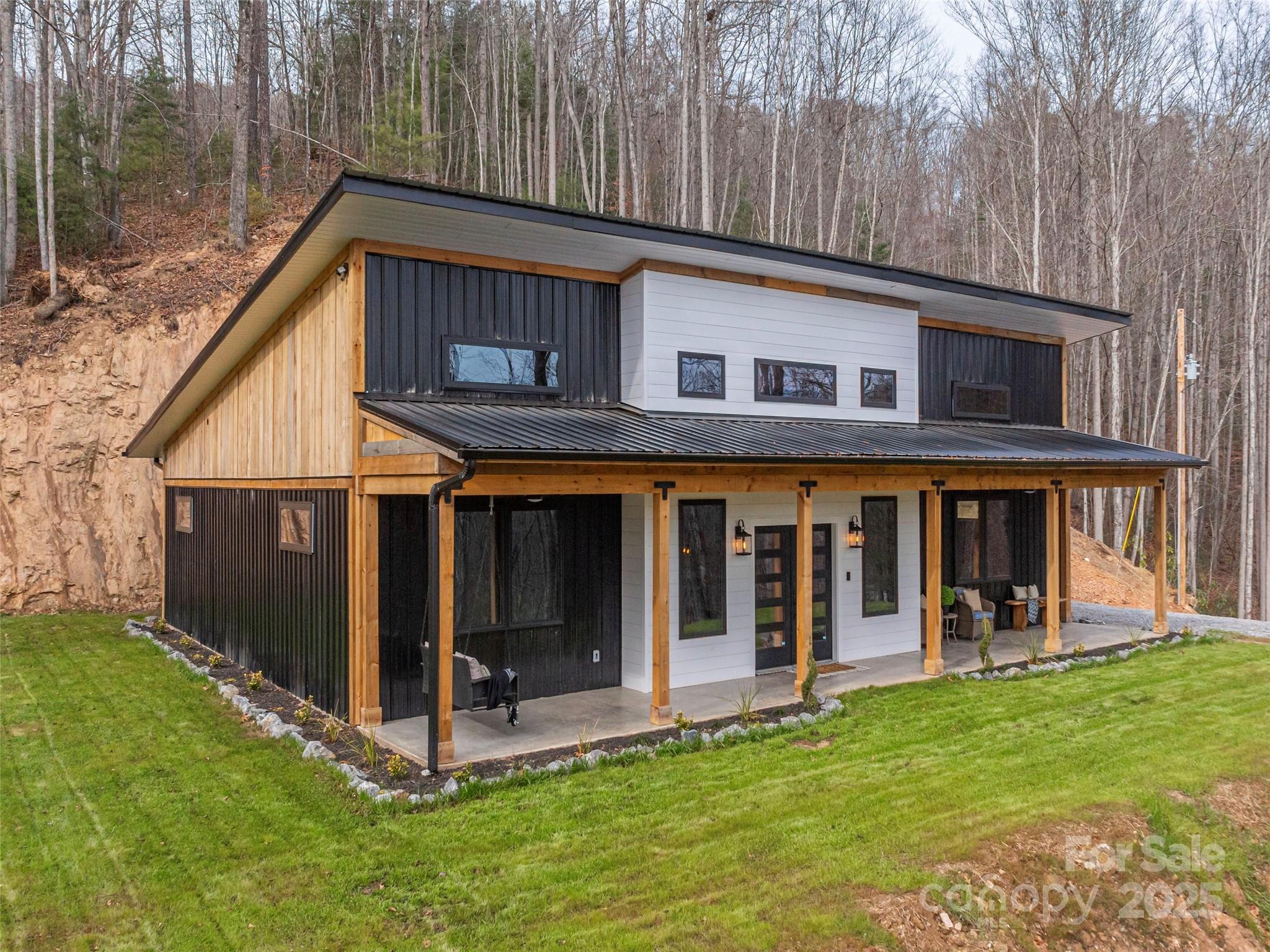 a view of a house with backyard porch and wooden floor