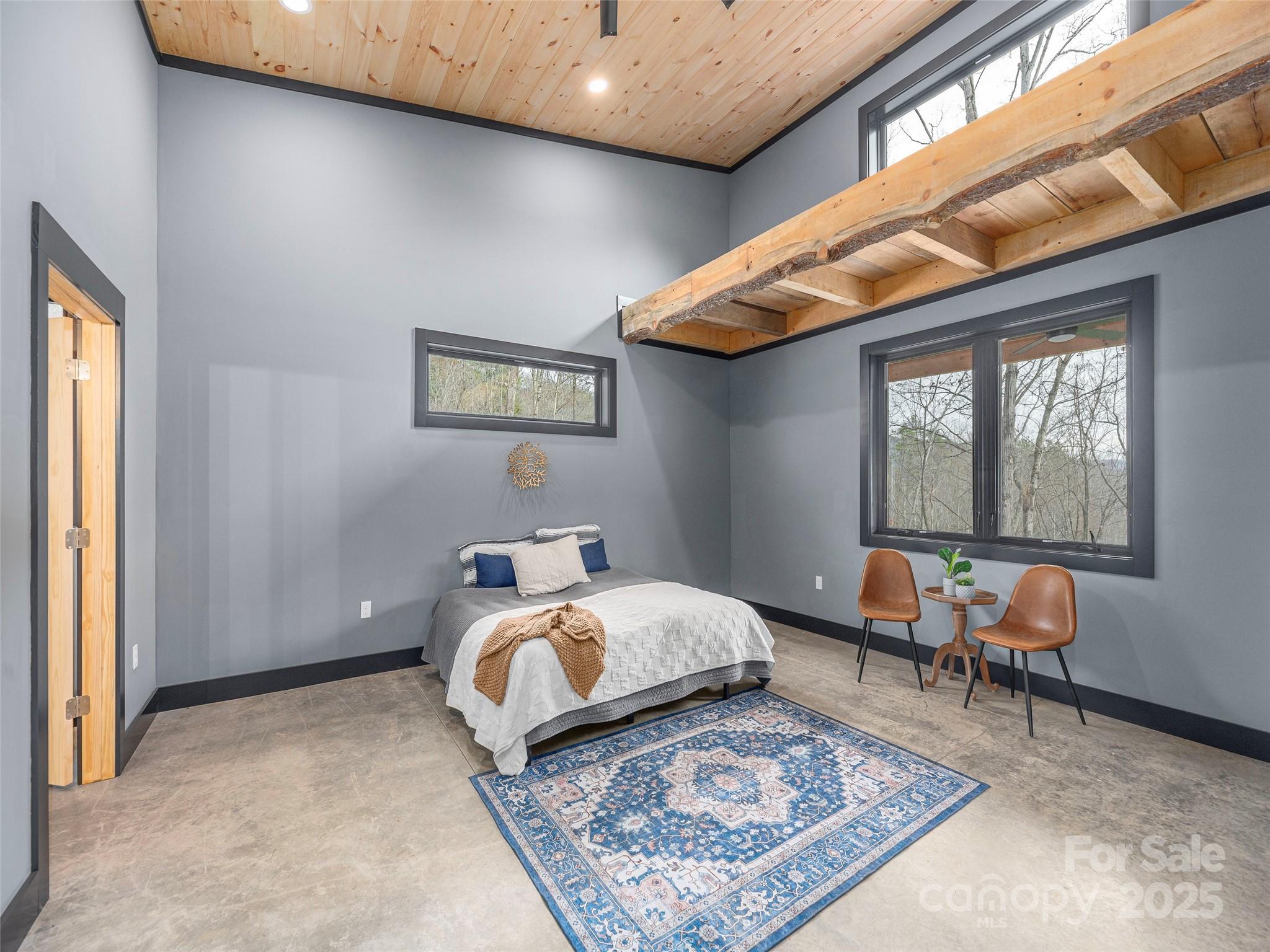 55 Dean Riddle Drive Waynesville, NC 28785 - Photo 16 of 35 a bedroom with bed and a window