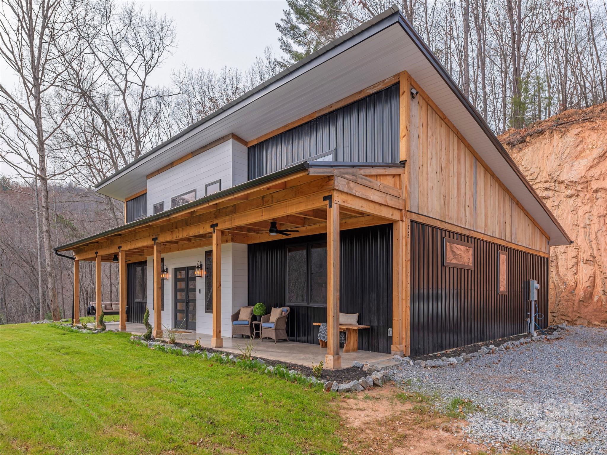 55 Dean Riddle Drive Waynesville, NC 28785 - Photo 2 of 35 a view of a house with yard and porch