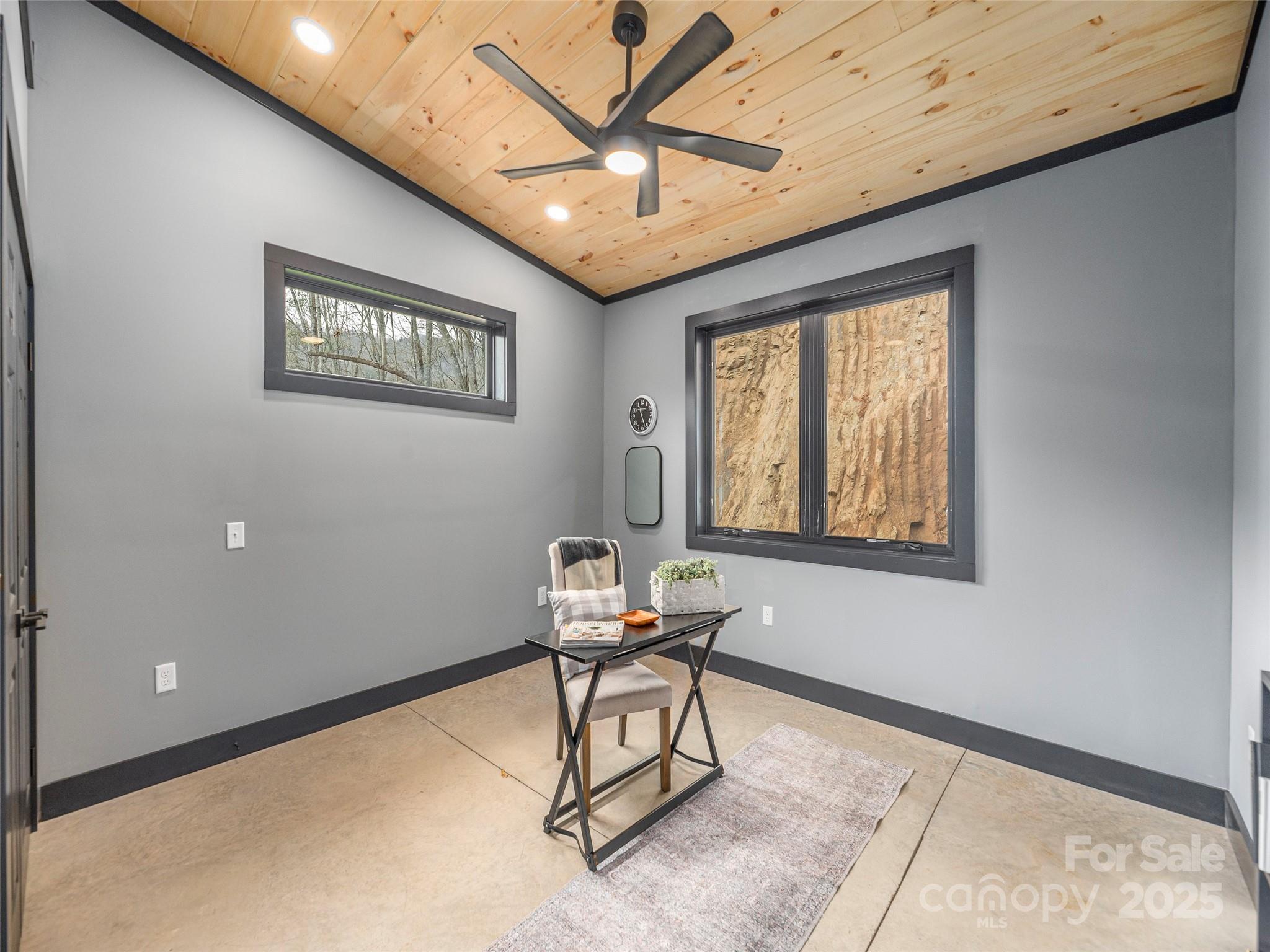 55 Dean Riddle Drive Waynesville, NC 28785 - Photo 26 of 35 a room with furniture and a window