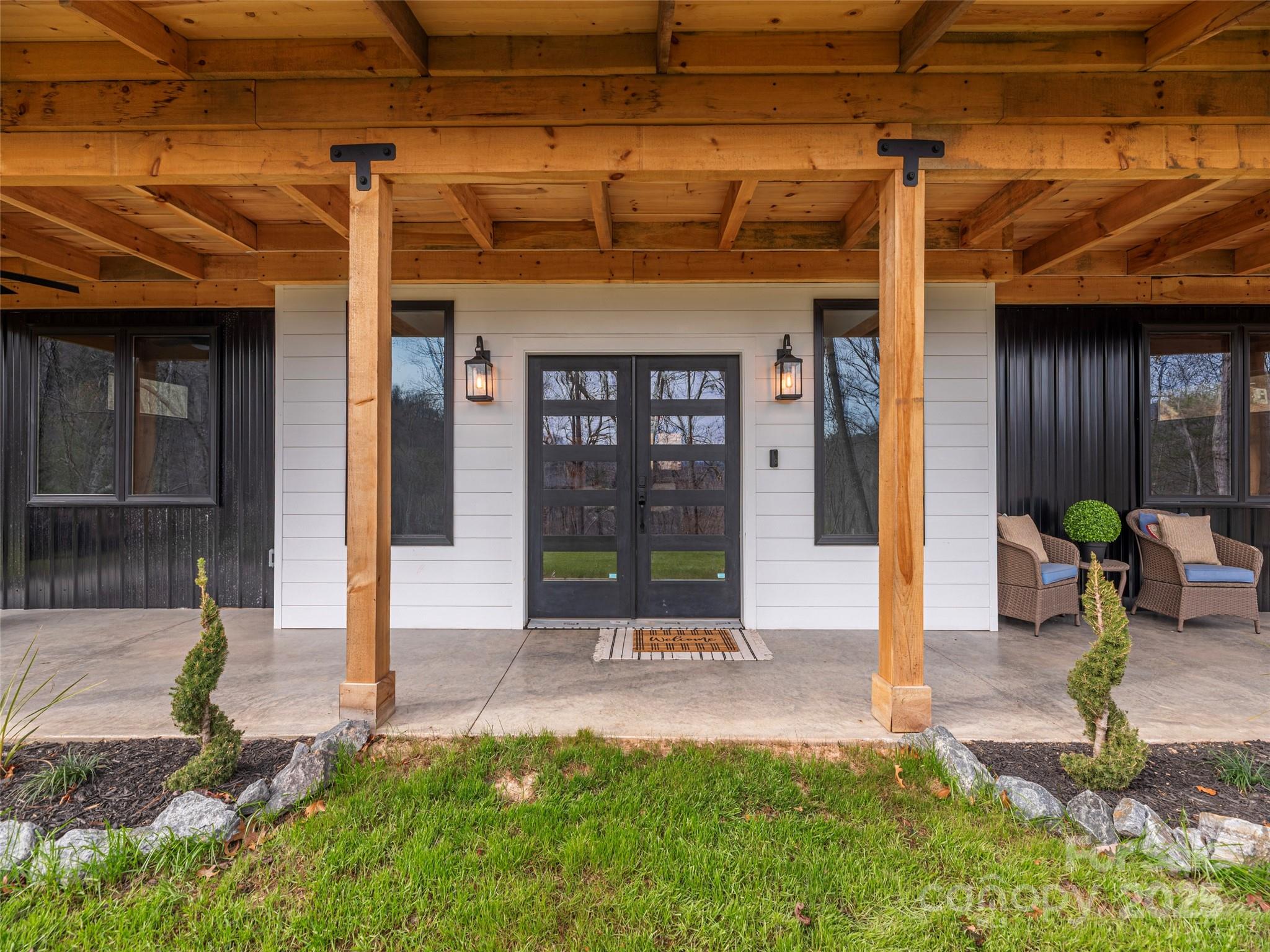 55 Dean Riddle Drive Waynesville, NC 28785 - Photo 6 of 35 a front view of a house with garden