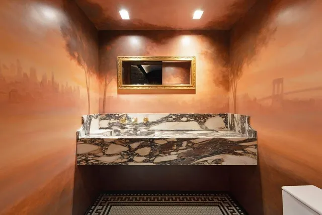 a living room with furniture a lamp and a fireplace