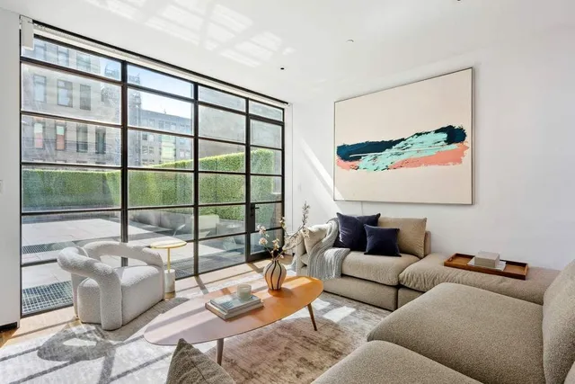 a bathroom with a toilet a sink a mirror and bathtub