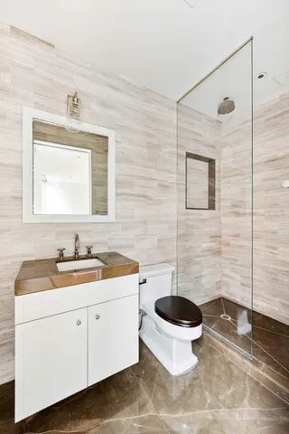 a view of a patio with couches and potted plants